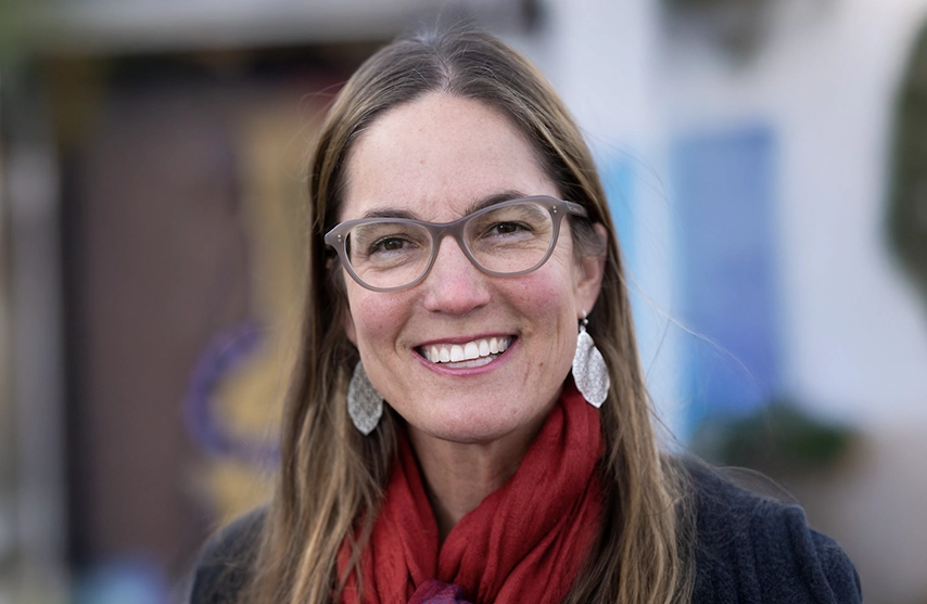 Kristy Nabhan-Waren, PhD, smiles into the camera.