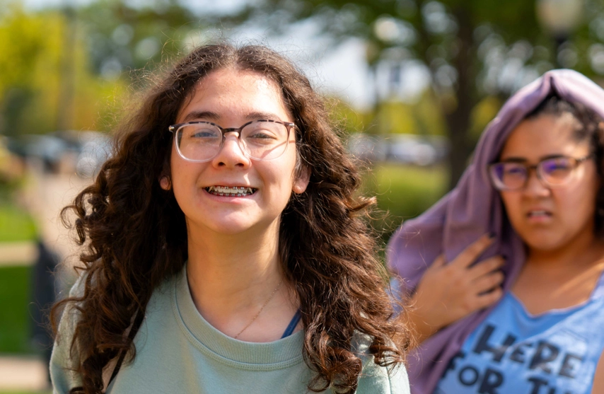 student smiling at the camera