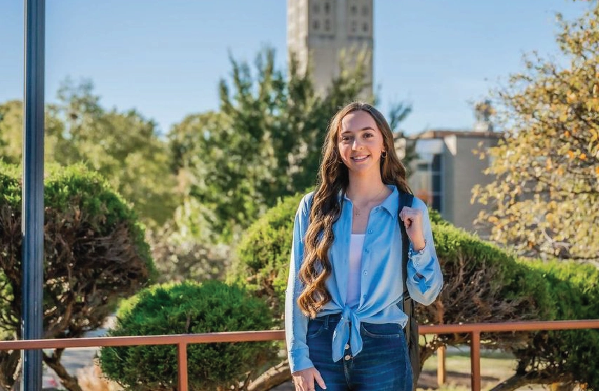 Marissa Steben smiles at camera standing outside