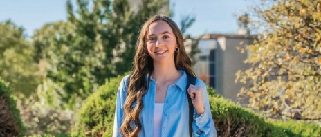 Marissa Steben smiles at camera standing outside