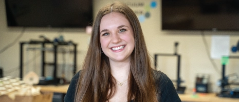 A smiling young woman.