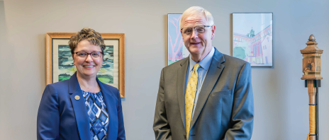 Presidents of St. Ambrose University and Mount Mercy University stand together in office.