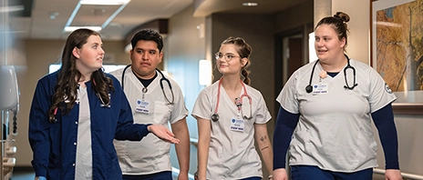 Nursing students walk and talk.