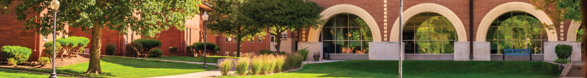 View of library windows exterior on a sunny day.