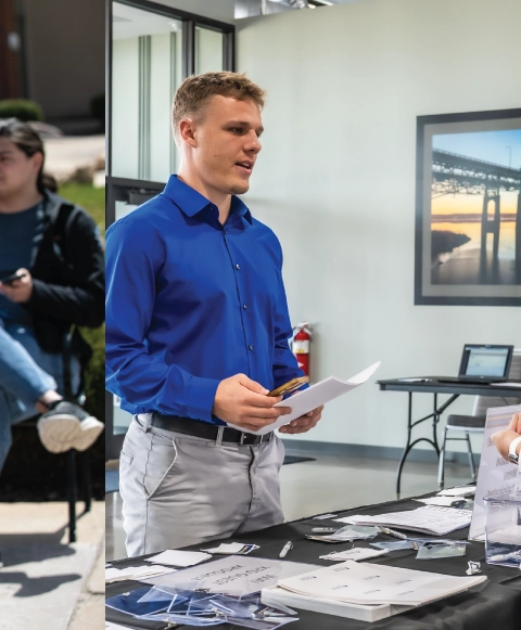 Man standing at booth at job fair.