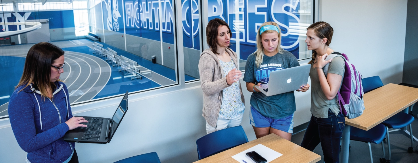 Sport management students in classroom overlooking athletic facilities.