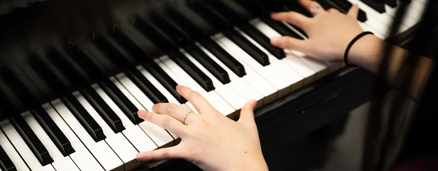 The hands of a musician playing piano.