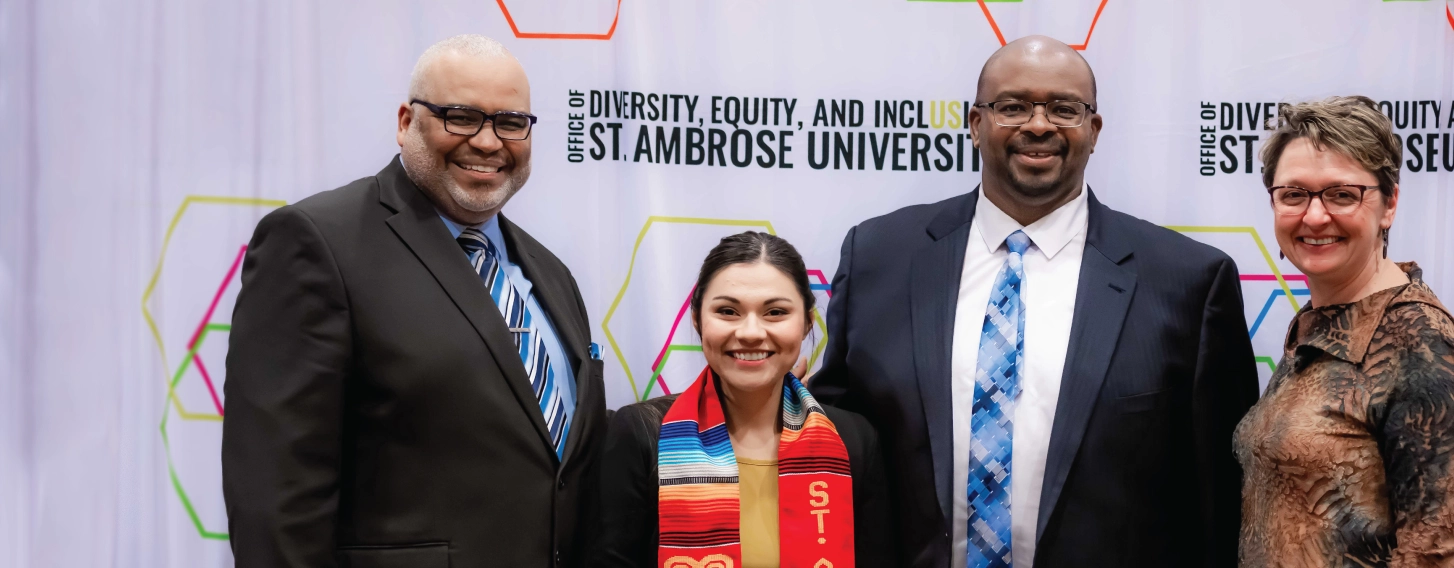 A group posing at a Diversity, Equity, and Inclusion event.