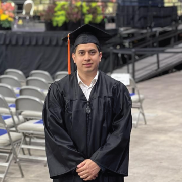 Headshot of Manuel Diaz wearing a cap and gown.