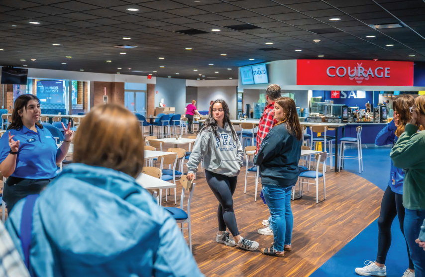 A tour of six people in a cafeteria