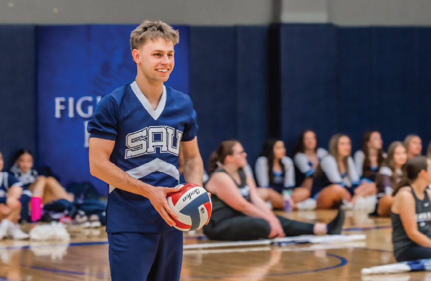 A mens volleyball player on the court