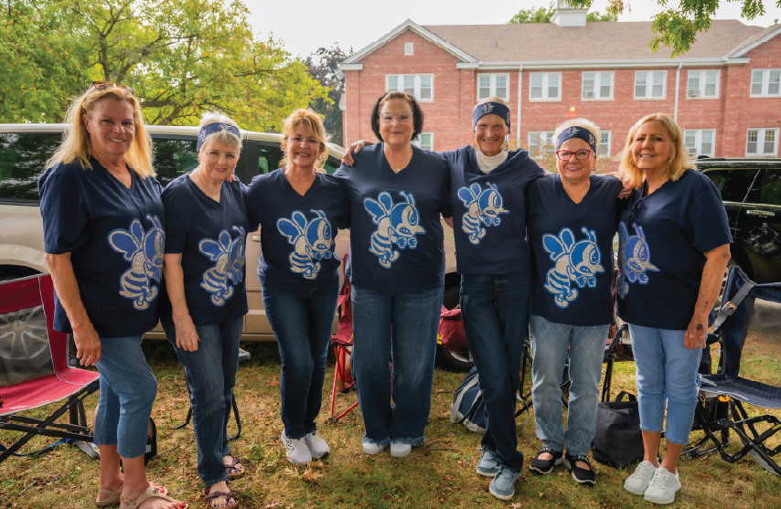 many alumni tailgating at homecoming with bee shirts
