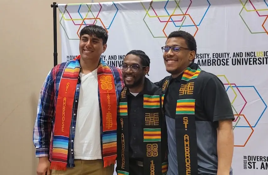 Three young men at commencement.