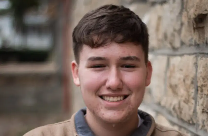 A smiling young man.