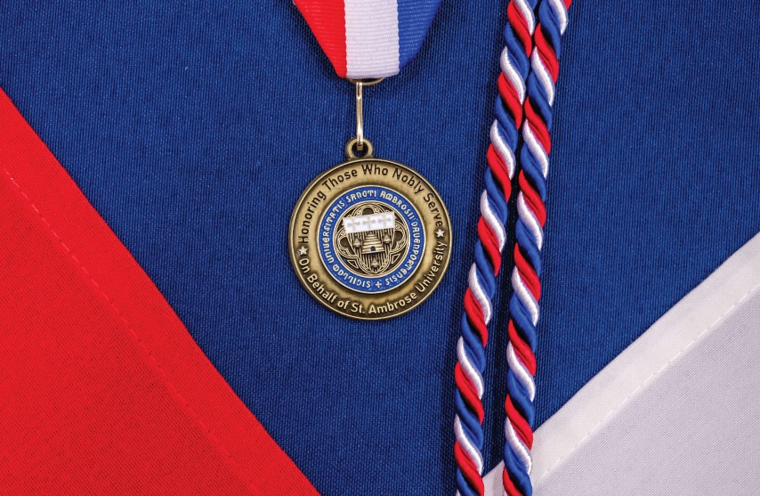 A veterans medal and a red, white, and blue cord given to graduating students who are veterans.