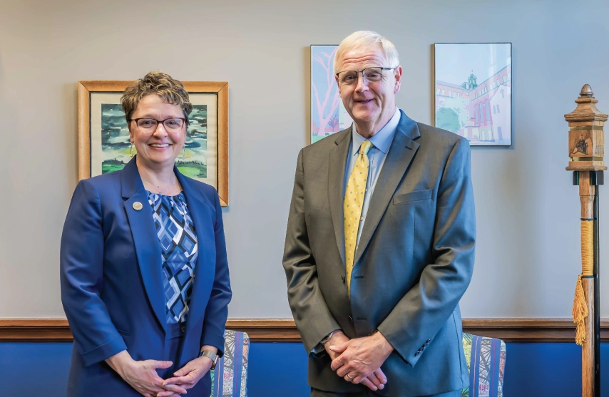 Dr. Amy Novak and Dr. Todd Olson posing for a picture together at Mount Mercy University