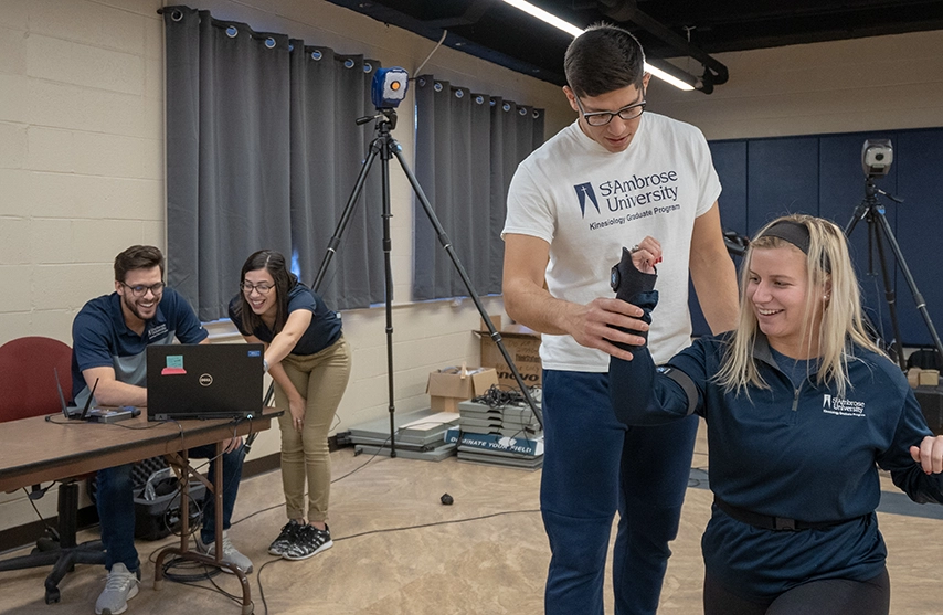Students practice physical therapy techniques.