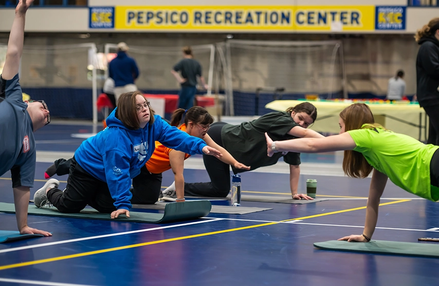 Students practice kinesiology techniques.