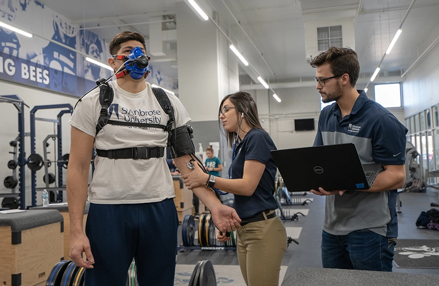 Students work together to practice their physical therapy techniques.