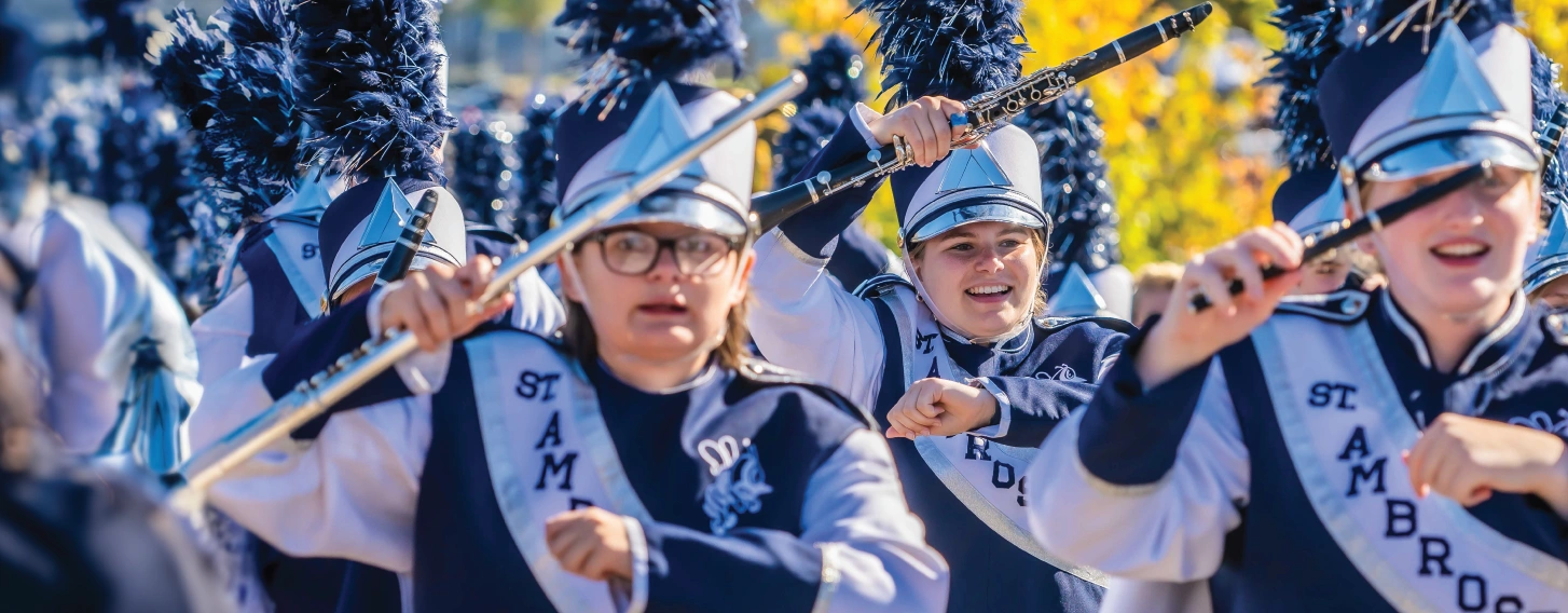 Marching band outdoors during homecoming.