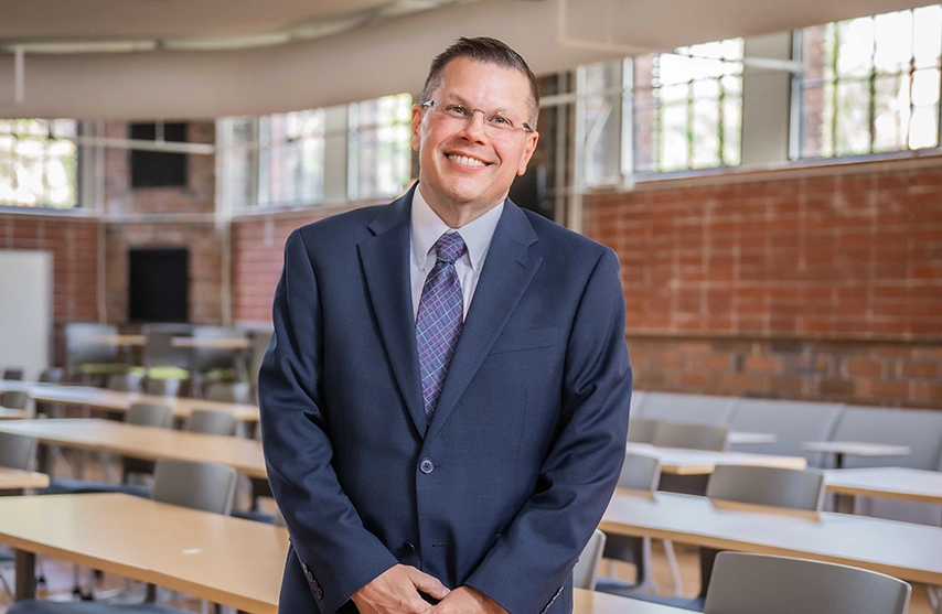 Toby Arquette, PhD, vice president for strategic growth, marketing, and digital transformation, in Higgins Hall.